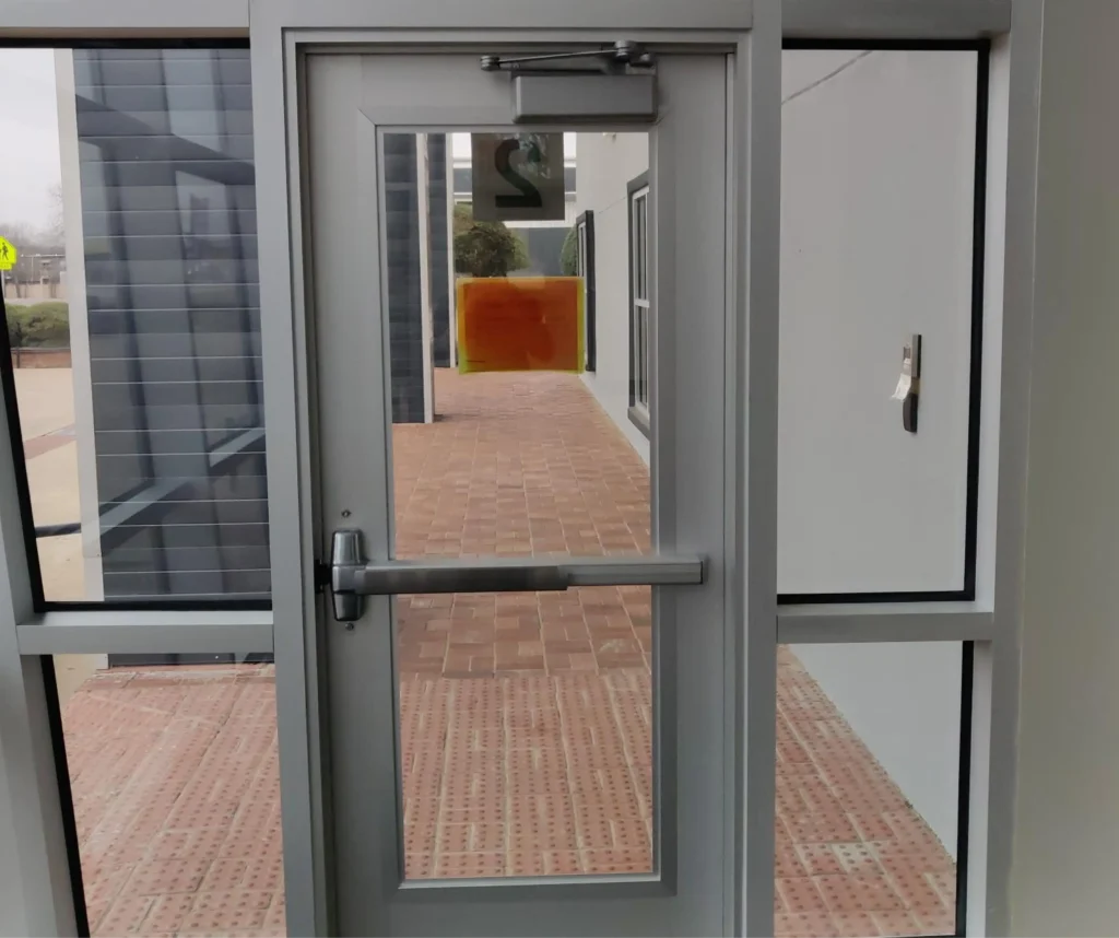 Commercial metal-framed glass door
