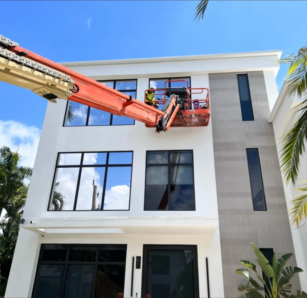 Lift truck positioned for window film installation on a commercial building